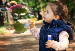 Child Blowing Bubbles